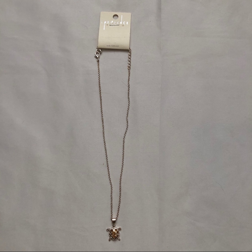 Necklace silver turtle with golden tint